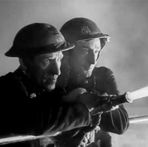 Battling the Flames (Screen capture from Fires Were Started, Crown Film Unit, 1943)