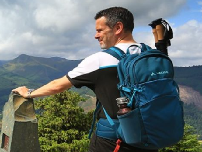 picture of Nick Hallisey hiking on top of a mountain