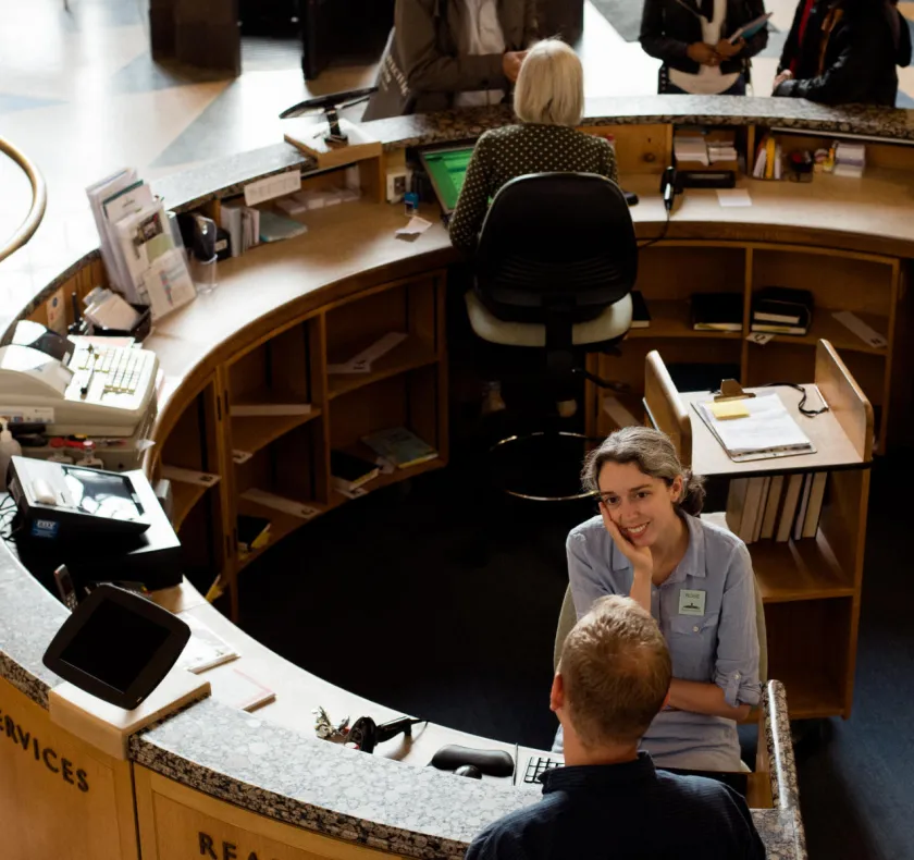 circular welcome desk in University Library entrance