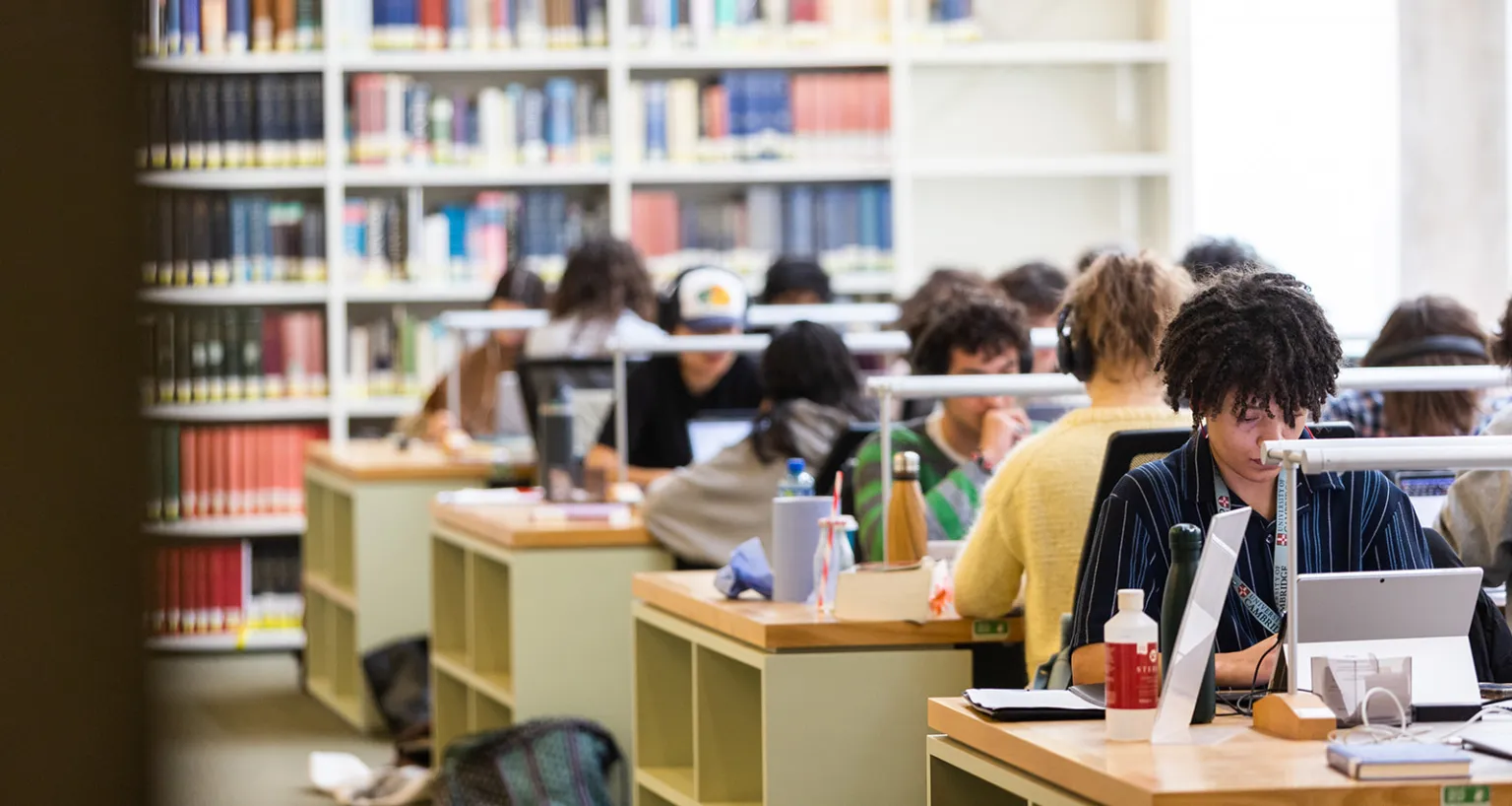 students working at library desks