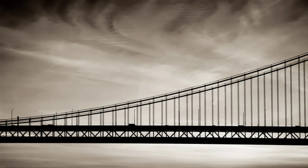 black and white photo of a bridge
